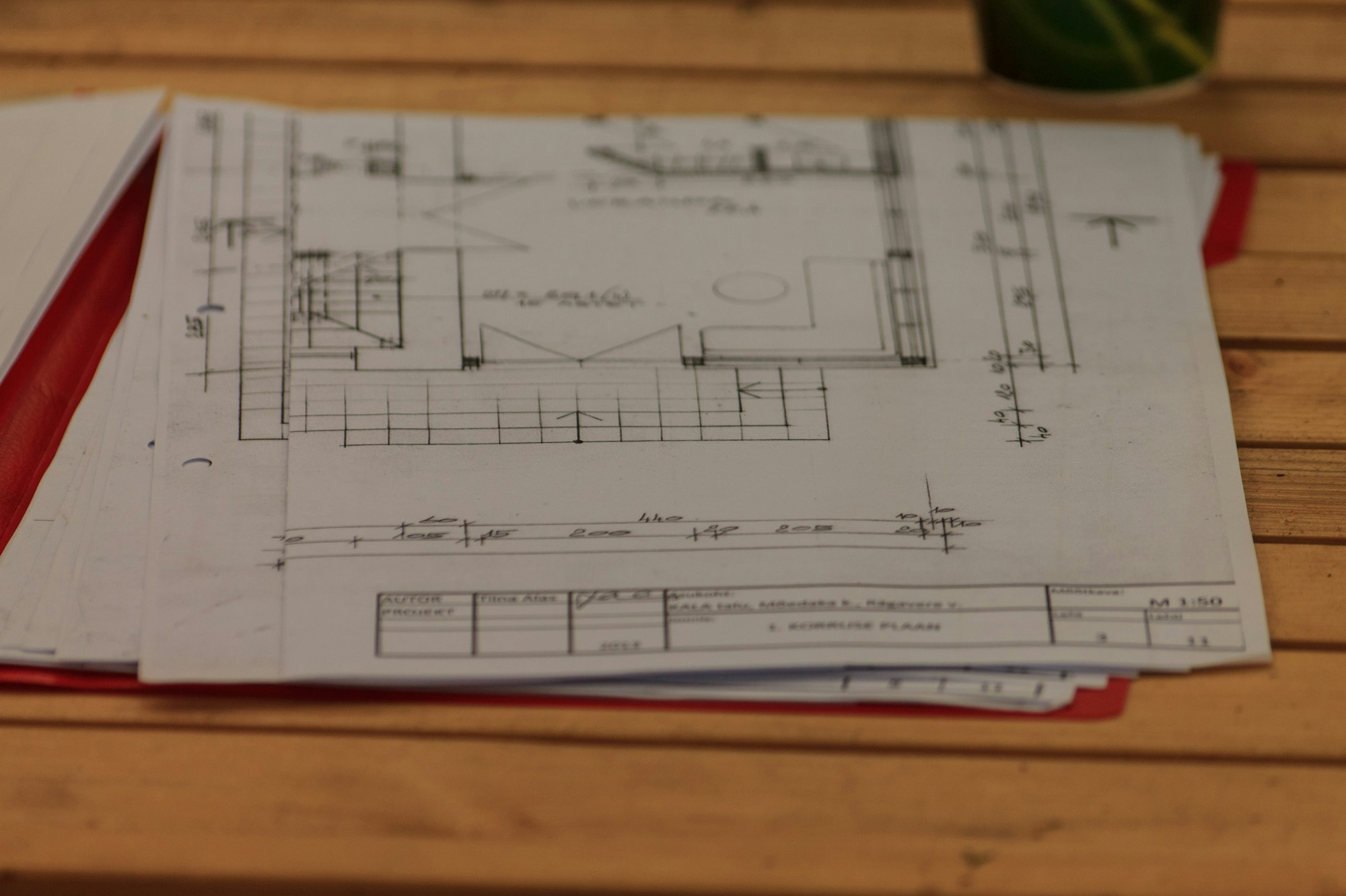 Technical drawings and measurements on the commercial desk